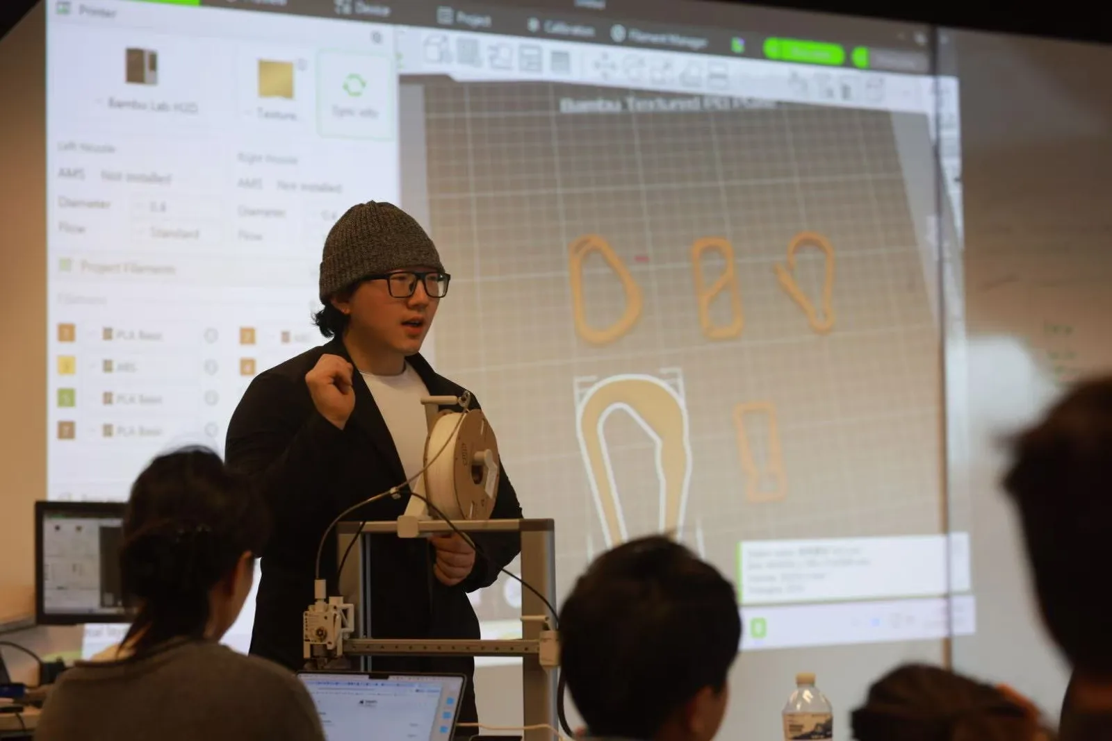 An instructor presenting the hook design challenge to participants
