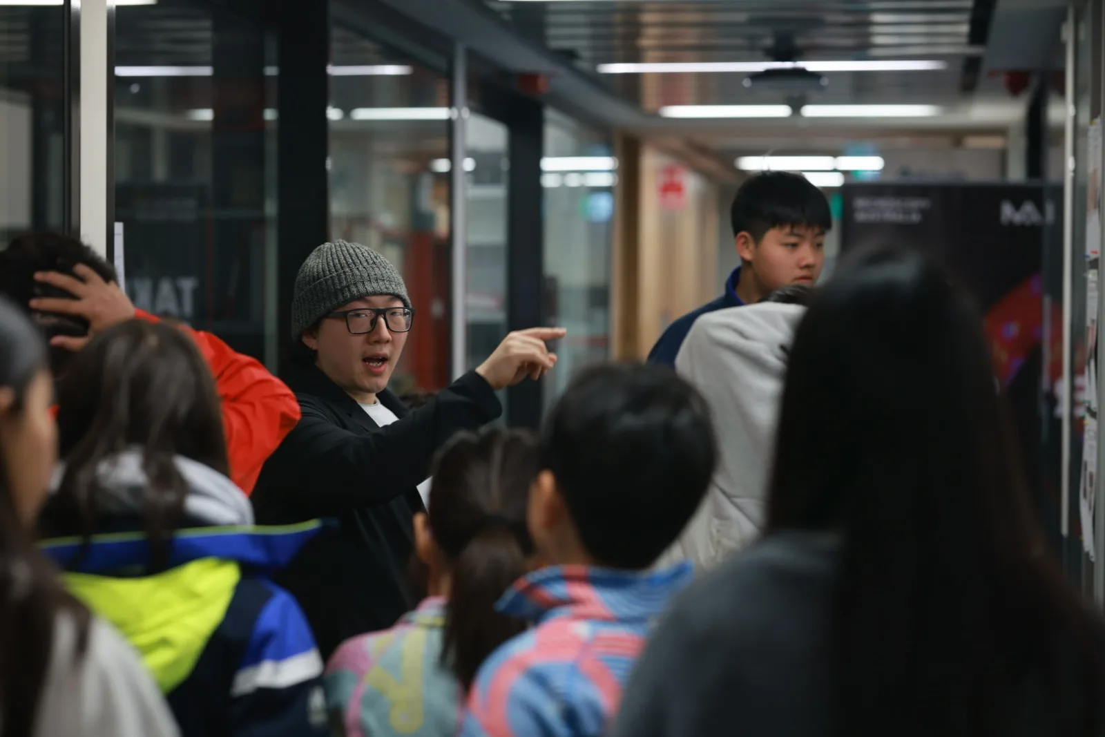 An instructor guiding students during the hook design activity