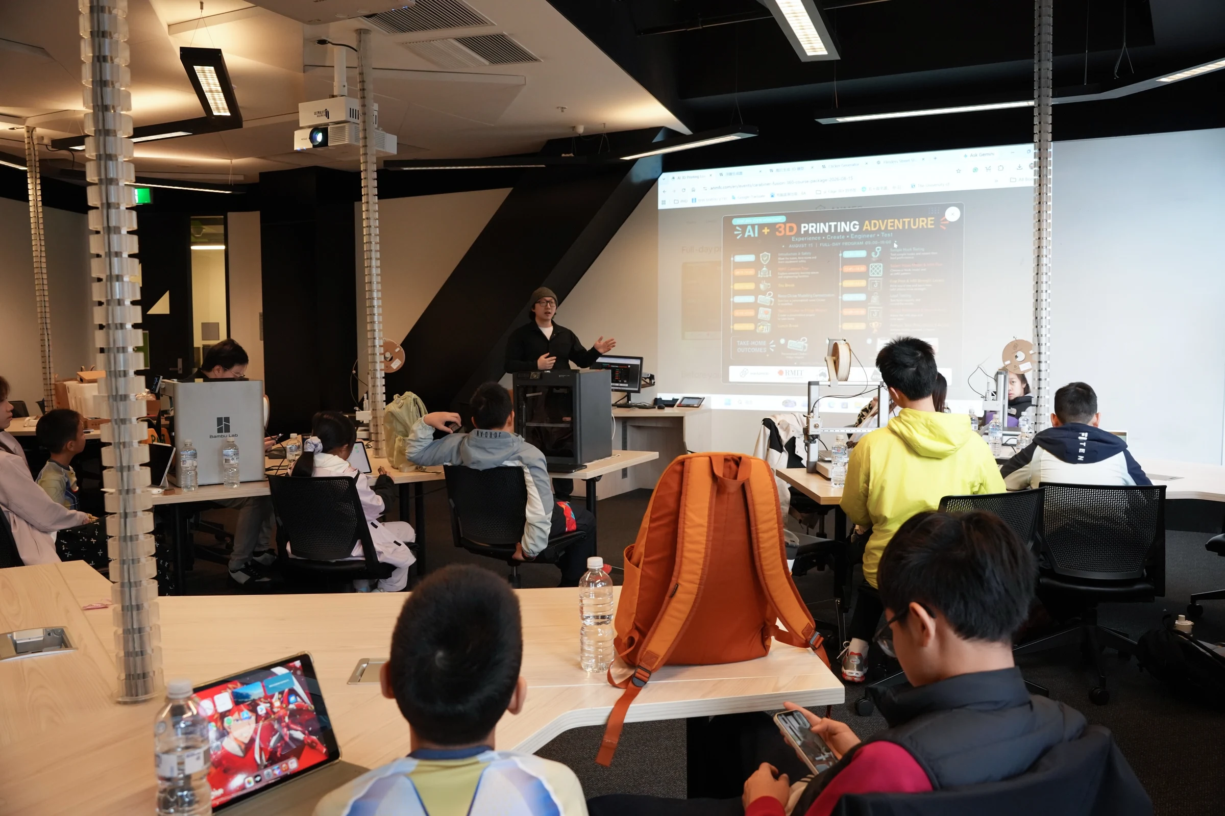 An instructor presenting the AI and 3D printing session to students