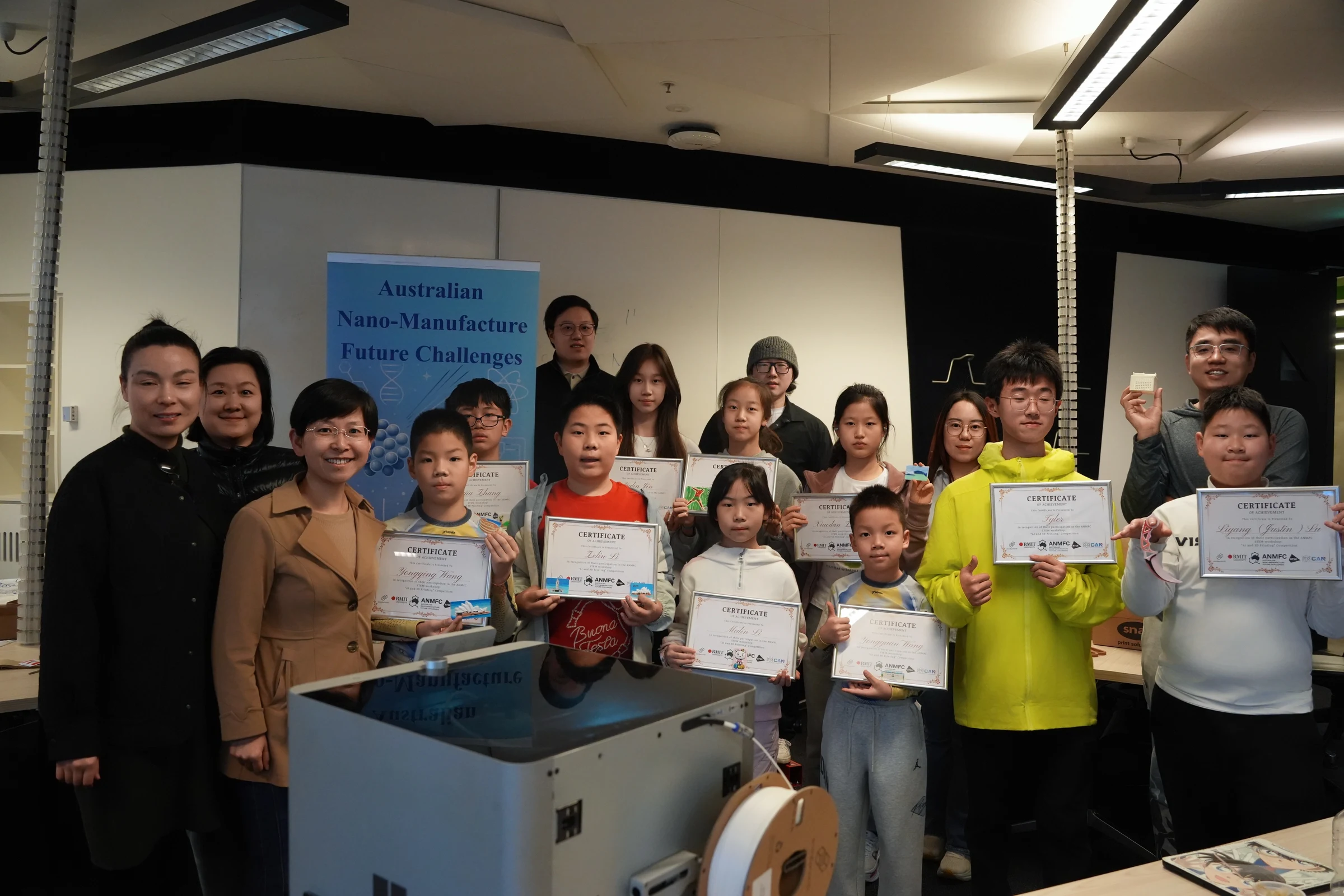Students and mentors posing with certificates in the workshop